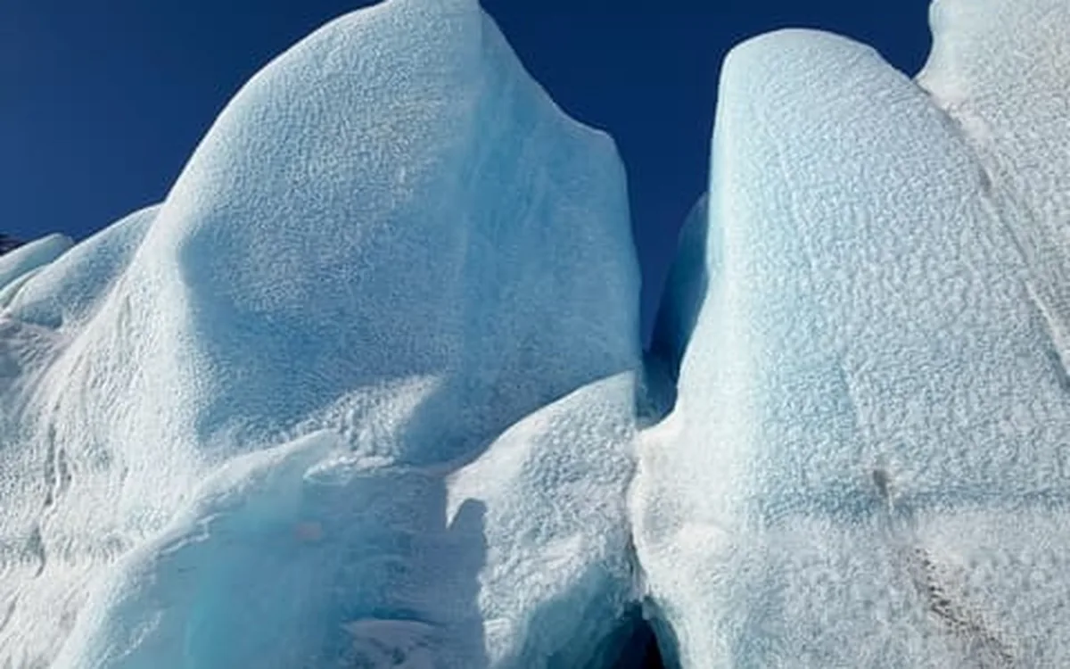 A wall of blue glacier ice on Knik Glacier, Alaska