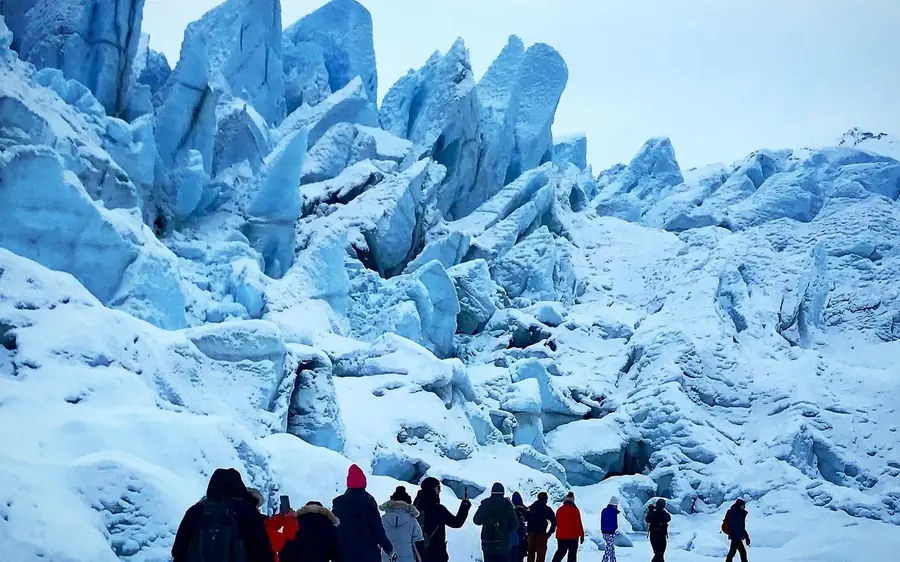 Walkers roped up on the surface of Matanuska Glacier, Alaska